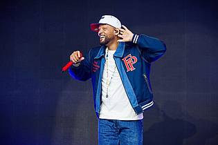 Moritz Frankenberg/dpa | Bevor er zum Blockbuster-Star wurde, stand Will Smith vor allem als Rapper im Rampenlicht ? so auch in Wolfsburg.