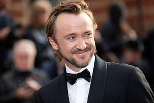 Vianney Le Caer/Invision via AP/dpa | Berühmt wurde er als der blonde Erzrivale Draco Malfoy: Tom Felton kehrt ins Harry-Potter-Universum zurück. (Archivbild)